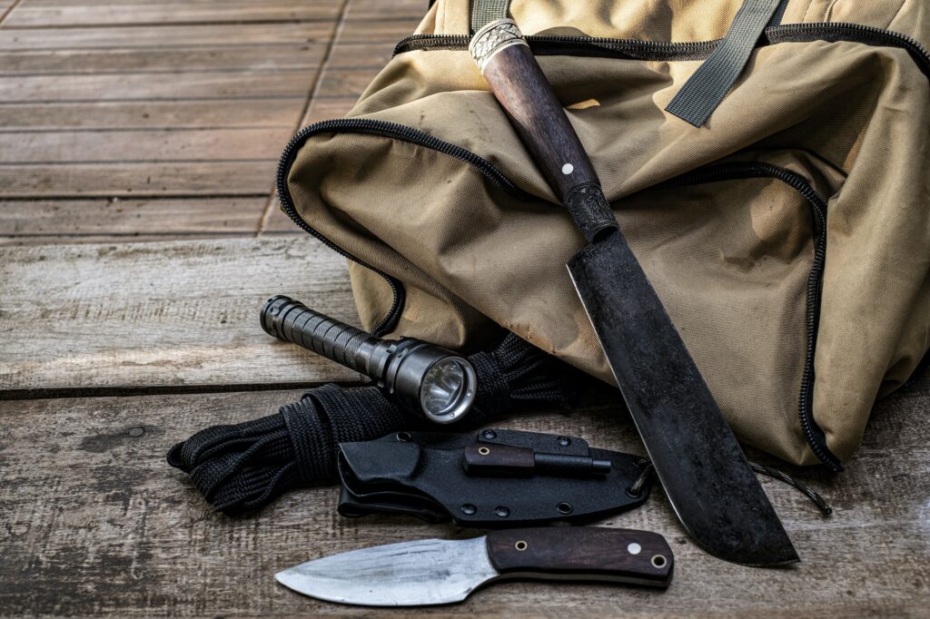 A knife with equipment for survival in the forest