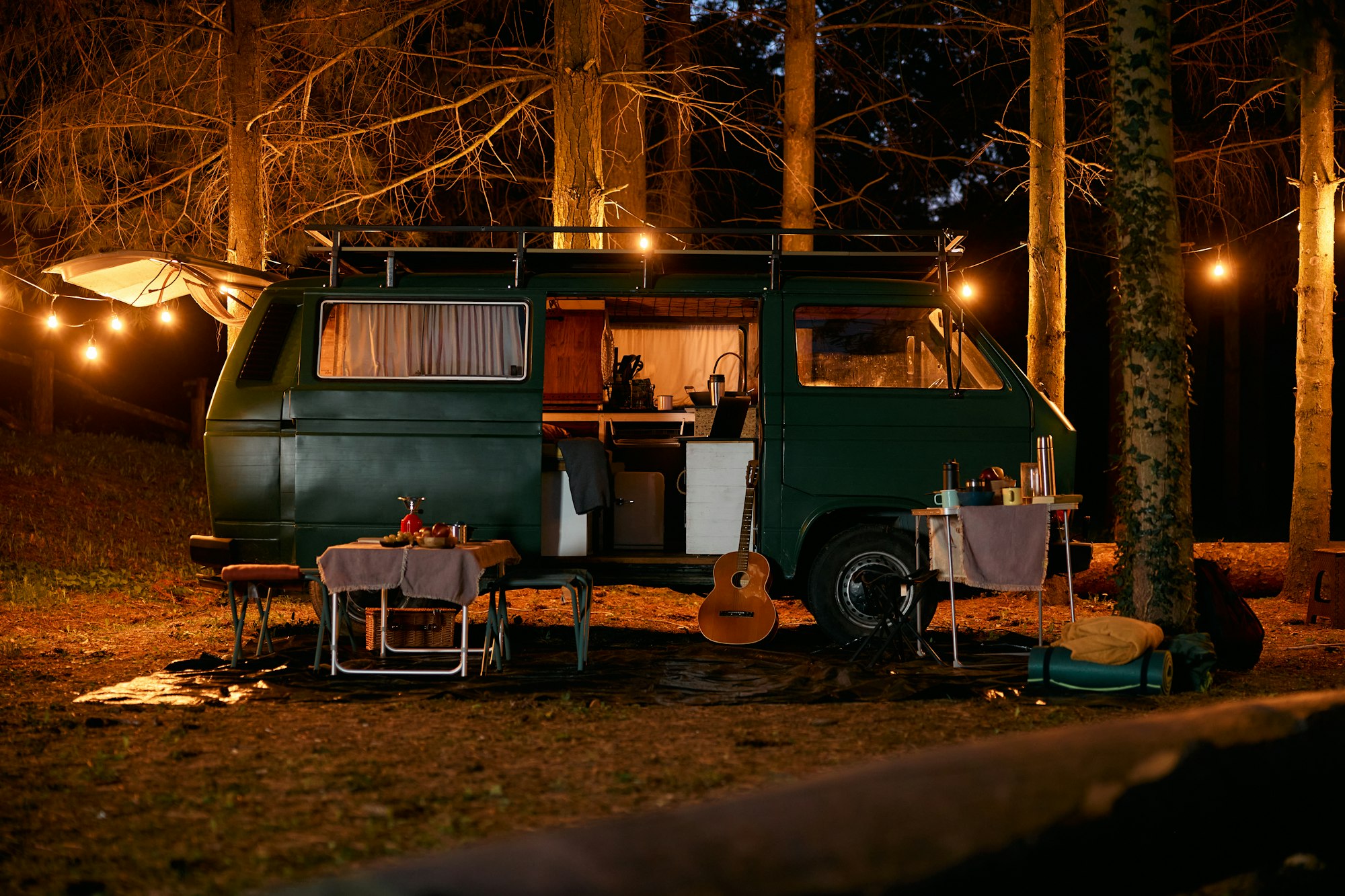 Camping van in trailer park at night.