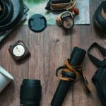 Camping gear on a wooden background